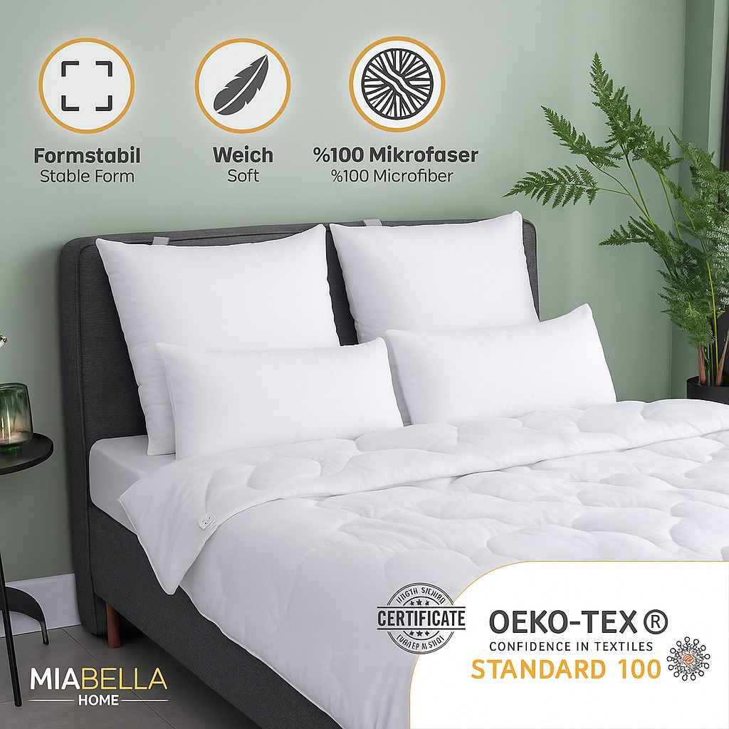 Mehrere Miabella Home Kissen auf einem Bett